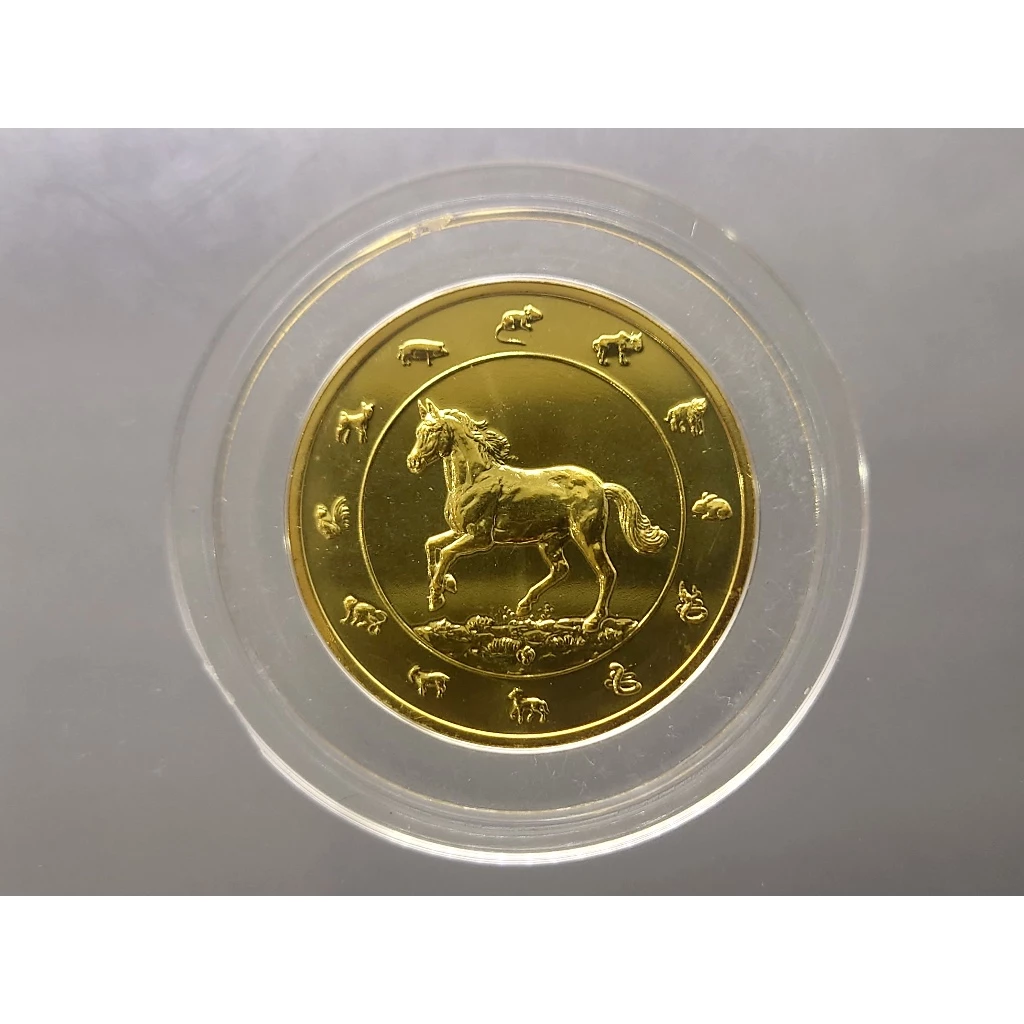 เหรียญนักษัตร ทองแดงชุบกาหลั่ยทอง ปีมะเมีย พ.ศ.2557 กรมธนารักษ์สร้าง ไม่ผ่านใช้ — ของมงคลหมวดราศีและนักษัตร
